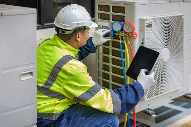 Professional Air Duct Cleaning technician working in Howell, NJ